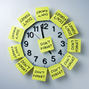 Wall clock with 'don't forget' notes all over